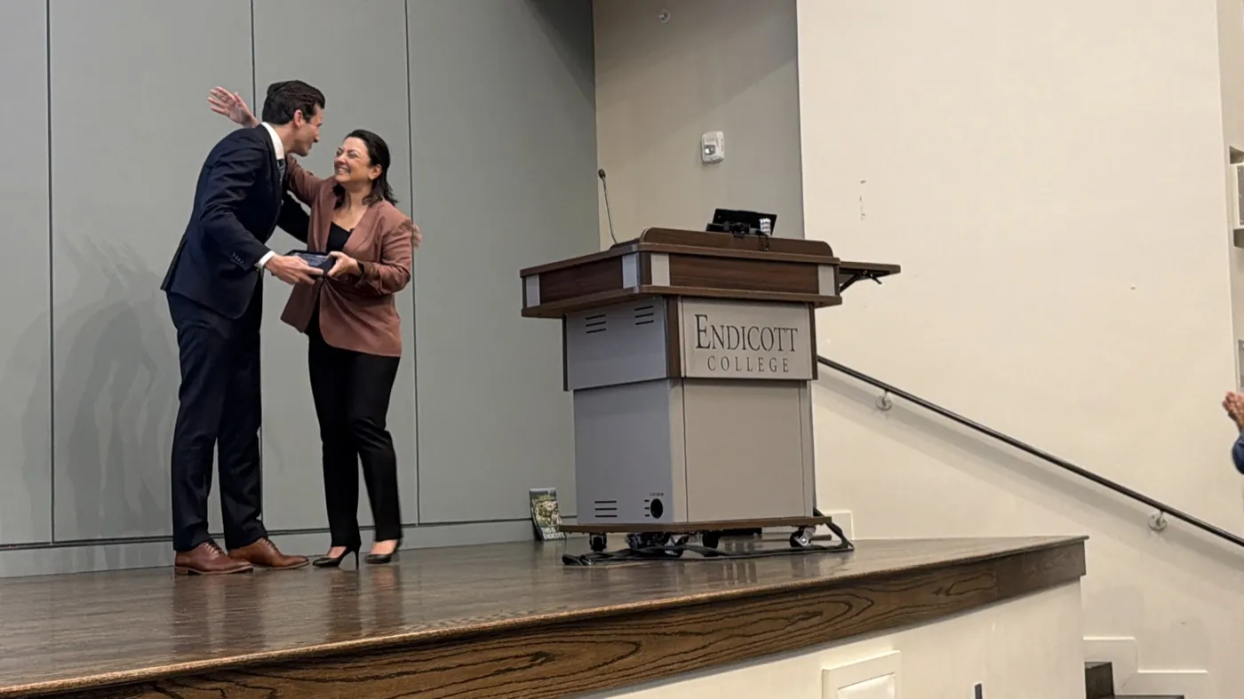 Ani Attamian presenting the Diruhi Mattian Award to Brian Anderson at Endicott College, May 2026